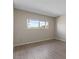 Neutral bedroom showcasing a window with views of beautiful outside greenery bringing in lots of natural light at 7430 E Chaparral Rd # A239, Scottsdale, AZ 85250