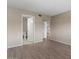 Spacious bedroom with wood-look flooring and attached bathroom and hallway giving the room an open feel at 7430 E Chaparral Rd # A239, Scottsdale, AZ 85250