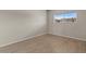 Well-lit bedroom featuring wood-look floors and a window showing outside building and beautiful blue sky at 7430 E Chaparral Rd # A239, Scottsdale, AZ 85250