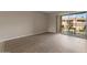 A bright bedroom with walk-out access to the patio and wood flooring at 7430 E Chaparral Rd # A239, Scottsdale, AZ 85250