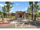 Image of the community clubhouse, featuring a covered entrance and lush landscaping at 7430 E Chaparral Rd # A239, Scottsdale, AZ 85250