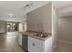 Bright kitchen featuring stainless steel appliances, double basin sink, and tile backsplash at 7430 E Chaparral Rd # A239, Scottsdale, AZ 85250