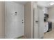 View of the kitchenette area by the entrance, featuring white appliances and cabinets at 7430 E Chaparral Rd # A239, Scottsdale, AZ 85250