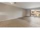 A spacious living room with tile flooring and sliding glass doors to outdoor patio at 7430 E Chaparral Rd # A239, Scottsdale, AZ 85250