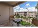 Comfortable patio space with patio furniture and lovely views of the community green space and desert landscaping at 7430 E Chaparral Rd # A239, Scottsdale, AZ 85250