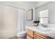 Well-lit bathroom with a shower, vanity, and a large mirror at 7500 E Deer Valley Rd # 68, Scottsdale, AZ 85255