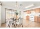 Bright dining area next to kitchen offering a sliding door to back yard and neutral paint at 7500 E Deer Valley Rd # 68, Scottsdale, AZ 85255