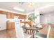 Cozy kitchen with adjacent dining area, abundant natural light, and white appliances at 7500 E Deer Valley Rd # 68, Scottsdale, AZ 85255