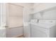 Bright laundry room featuring a white washer and dryer at 7500 E Deer Valley Rd # 68, Scottsdale, AZ 85255