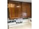 Kitchen cabinetry detail with white countertops and mosaic backsplash, adding modern touch to the culinary space at 839 S Westwood -- # 187, Mesa, AZ 85210