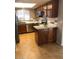 Well-lit kitchen with stainless steel appliances, ample cabinet space, and light countertops, with tile backsplash and flooring at 839 S Westwood -- # 187, Mesa, AZ 85210