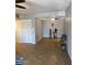 Bright, open living area with tile flooring, showcasing a large closet and a decorative display on a small table at 839 S Westwood -- # 187, Mesa, AZ 85210