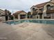 Community pool surrounded by tile, adjacent to a covered ramada for outdoor leisure at 839 S Westwood -- # 187, Mesa, AZ 85210
