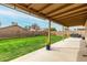 The expansive backyard features a covered patio and a large grassy area, perfect for outdoor entertaining at 8541 W Echo Ln, Peoria, AZ 85345