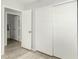 Bedroom features wood look floors, closet and doors to additional rooms at 8541 W Echo Ln, Peoria, AZ 85345