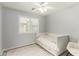 Cozy bedroom with a daybed, ceiling fan and a window with views of the outdoors at 8541 W Echo Ln, Peoria, AZ 85345
