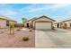 Charming single-story home featuring a two car garage and desert landscaping at 8541 W Echo Ln, Peoria, AZ 85345
