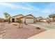 Beautiful single-Gathering home displaying a manicured yard and a spacious driveway at 8541 W Echo Ln, Peoria, AZ 85345