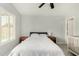 Stylish bedroom featuring wood-look tile flooring, neutral walls, and a ceiling fan at 8541 W Echo Ln, Peoria, AZ 85345