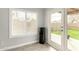 Bright sunroom with shuttered windows, tile flooring, and access to the outdoor patio at 8541 W Echo Ln, Peoria, AZ 85345