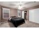 Cozy bedroom featuring a neutral color scheme, plush carpet, closet and windows for natural light at 8947 W Sierra Vista Dr, Glendale, AZ 85305