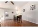 Well-lit dining room with hardwood floors and direct access to other rooms within the home at 8947 W Sierra Vista Dr, Glendale, AZ 85305