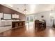 Spacious kitchen and dining area with hardwood floors, a breakfast bar, and sliding doors leading to the backyard at 8947 W Sierra Vista Dr, Glendale, AZ 85305