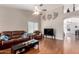 Open living room with a comfortable seating arrangement, hardwood floors, and decorative lighting at 8947 W Sierra Vista Dr, Glendale, AZ 85305