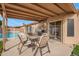Covered patio with outdoor dining set, barbecue and view of the pool at 8947 W Sierra Vista Dr, Glendale, AZ 85305