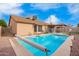 View of backyard featuring a private pool, lounge chairs and a covered patio at 8947 W Sierra Vista Dr, Glendale, AZ 85305