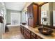 Well-appointed bathroom featuring dual sinks, granite countertops, and a soaking tub at 8960 W Kerry Ln, Peoria, AZ 85382