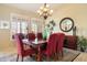 Formal dining room featuring stylish furniture, elegant lighting, and neutral decor at 8960 W Kerry Ln, Peoria, AZ 85382