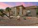 Single story home featuring desert landscaping, pillars, and large front windows at 8960 W Kerry Ln, Peoria, AZ 85382