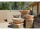 Outdoor water fountain adds tranquility to the backyard with a stone-stacked base at 8960 W Kerry Ln, Peoria, AZ 85382