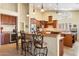 Well-equipped kitchen with granite countertops, custom cabinets, and stainless steel appliances at 8960 W Kerry Ln, Peoria, AZ 85382