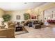 Spacious living room with high ceilings, tile flooring, and neutral paint tones at 8960 W Kerry Ln, Peoria, AZ 85382