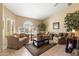 Cozy living room with abundant natural light and comfortable seating arrangement at 8960 W Kerry Ln, Peoria, AZ 85382