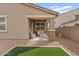 Comfortable outdoor seating area on the back patio, surrounded by desert landscaping at 9910 E Theia Dr, Mesa, AZ 85212