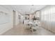 Open-concept dining flowing into kitchen, providing ample space for gathering and entertaining at 9910 E Theia Dr, Mesa, AZ 85212