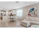 Spacious living space flows into the kitchen and dining area, creating a welcoming and functional home design at 9910 E Theia Dr, Mesa, AZ 85212