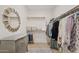 Functional walk-in closet with shelving, dresser and ample storage space at 9910 E Theia Dr, Mesa, AZ 85212