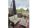 Cozy patio offers outdoor seating with a view, sheltered by an umbrella for comfortable relaxation at 114 N 119Th Dr, Avondale, AZ 85323