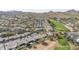 Panoramic aerial view of a golf course community featuring luxury homes with backyard pools and lush desert landscaping at 1240 E Friess Dr, Phoenix, AZ 85022