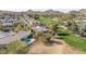 Stunning aerial view of a golf course community, highlighting luxurious homes with pools and desert landscape at 1240 E Friess Dr, Phoenix, AZ 85022