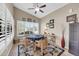 Inviting dining area with large windows, neutral decor, and stylish furniture at 1240 E Friess Dr, Phoenix, AZ 85022