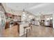 Kitchen island with granite counters, modern lighting, and appliances open to living room at 1240 E Friess Dr, Phoenix, AZ 85022