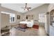 Bright main bedroom featuring a ceiling fan, shutters, and coordinating decor at 1240 E Friess Dr, Phoenix, AZ 85022