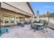 Back patio with tile flooring and a vaulted ceiling, surrounded by desert landscaping at 1240 E Friess Dr, Phoenix, AZ 85022