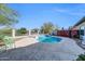 Private backyard pool featuring a classic design, ample patio space, and views of the desert landscape at 1240 E Friess Dr, Phoenix, AZ 85022