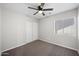 A bright bedroom featuring a modern ceiling fan, a closet, and a window providing ample natural light at 1244 E Princeton Ave, Gilbert, AZ 85234